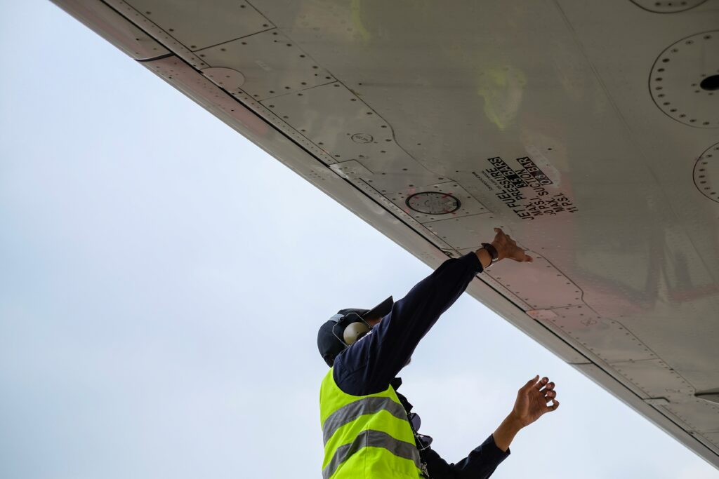 Engineer fixing aircraft wing